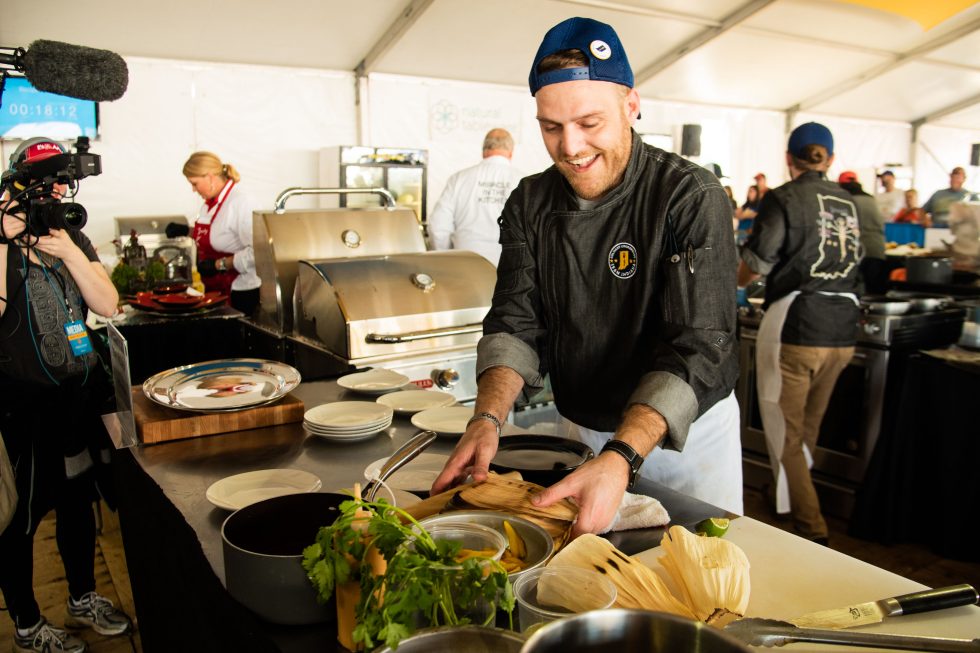Justin Miller cooking at an event